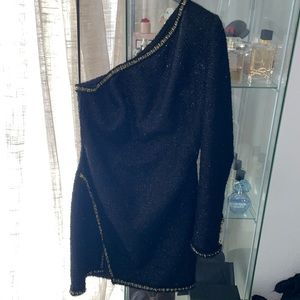 Black one sleeve dress with gold trimmings and button